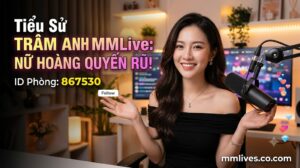 Banner hồ sơ idol Trâm Anh MMLive, giới thiệu 'Nữ hoàng quyến rũ!' với ID phòng 867530. Hình ảnh một nữ streamer trẻ mỉm cười trước thiết bị livestream, với các biểu tượng trái tim và kim cương bay lên. Bao gồm domain mmlive8.jp.net.